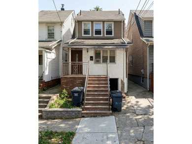 Flushing legal two-family home, fully renovated with extensive - photo 1