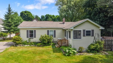 Welcome to this well-maintained home tucked into an established - photo 1