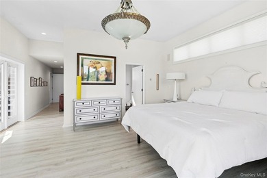 Set on 0.69 acres, bordering a two-acre dune preserve, this - photo 11