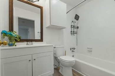 Welcome to Lakewood Village! This charming end-unit condo offers - photo 12
