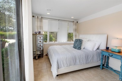 Set on 0.69 acres, bordering a two-acre dune preserve, this - photo 18