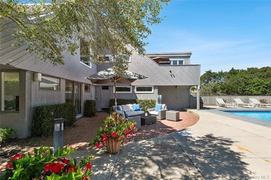 Set on 0.69 acres, bordering a two-acre dune preserve, this - photo 23