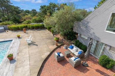 Set on 0.69 acres, bordering a two-acre dune preserve, this - photo 29