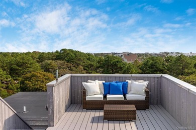 Set on 0.69 acres, bordering a two-acre dune preserve, this - photo 30