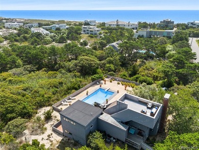 Set on 0.69 acres, bordering a two-acre dune preserve, this - photo 35