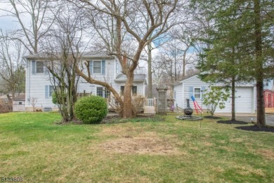 Enjoy all that lake life has to offer with this colonial home - Lake Home Sale Pending in West Milford, New Jersey