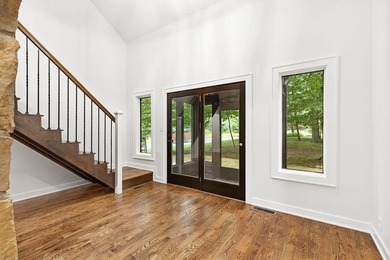 Beautifully renovated lakefront contemporary home, complete with - photo 3