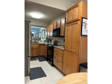 Discover this delightful first-floor unit in the sought-after - photo 14