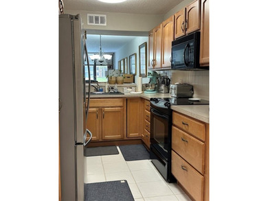 Discover this delightful first-floor unit in the sought-after - photo 16