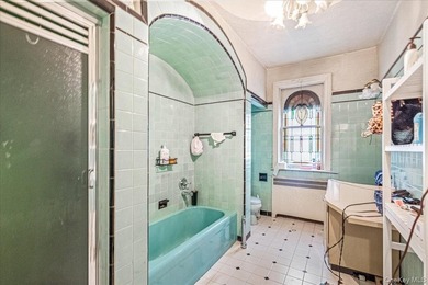 Welcome to 1404 E 49th Street, a semi-detached brick one-family - photo 17