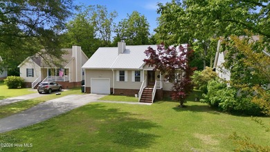 Welcome home to this charming move-in ready property tucked away - photo 3