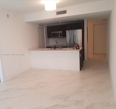 Welcome to Aria on the Bay--a soaring masterpiece of modern