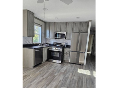 Discover affordable new home living at Tall Oaks #7, a charming - photo 1