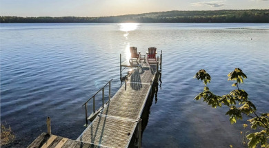 Winnipesaukee home with shared beach, day dock moorings and boat - photo 24