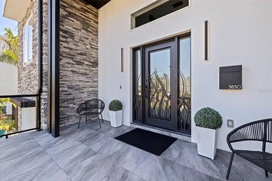 This exceptional waterfront residence, built in 2023, delivers a