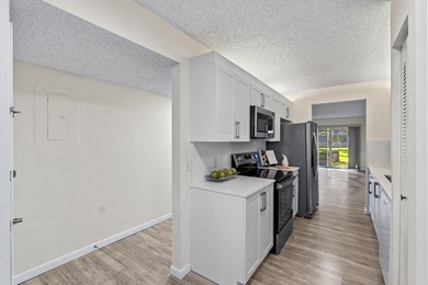 Beautifully renovated 2 BD, 2 BA first-floor condo in Century - photo 11