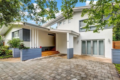 Located in Bay Heights, this 4-bedroom, 4.5-bath residence - photo 1