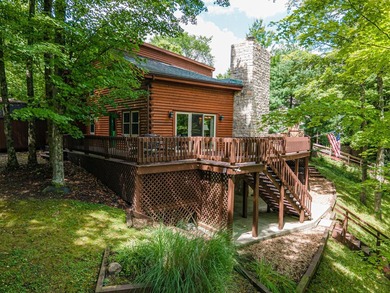 This visually stunning, premier lakefront log home on a - photo 13