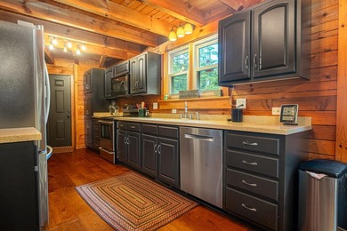This visually stunning, premier lakefront log home on a - photo 40