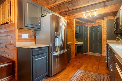 This visually stunning, premier lakefront log home on a - photo 41