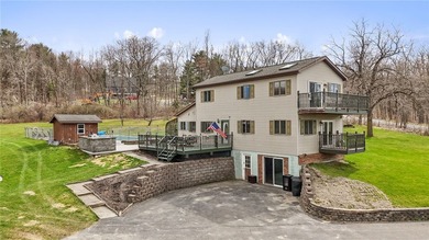 Set on 3 acres in the hills of Hector, this 3,100 sq ft - photo 1