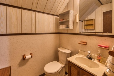 Nestled in a quiet wooded setting, this charming chalet-style - photo 16