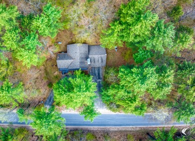 Nestled in a quiet wooded setting, this charming chalet-style - photo 21