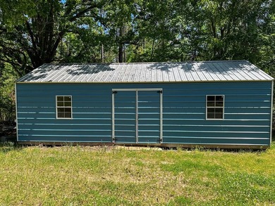 Well-maintained 3 bedroom, 2 bath mobile home on 74 acres. The - photo 35