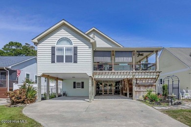 Just a golf cart ride from the shoreline, this coastal retreat - photo 3