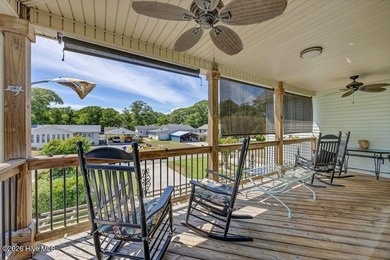 Just a golf cart ride from the shoreline, this coastal retreat - photo 4