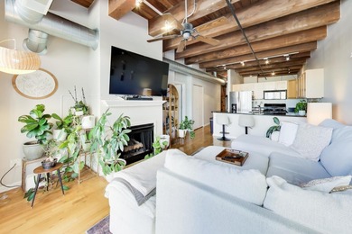 Step into this stunning brick-and-timber loft at the Premiere