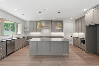 This 4 bed, 3.5 bath home sits on a flat 0.5 acre lot with 115' - photo 18