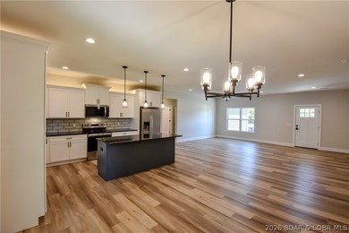 BRAND NEW HOME in the HEART of Osage Beach!! This striking home - photo 11