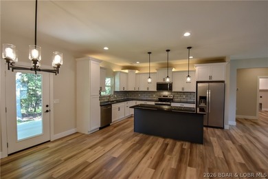 BRAND NEW HOME in the HEART of Osage Beach!! This striking home - photo 13