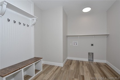 BRAND NEW HOME in the HEART of Osage Beach!! This striking home - photo 17
