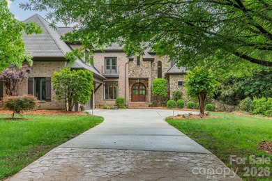 Located in the exclusive gated community of Chatelaine, this - photo 1