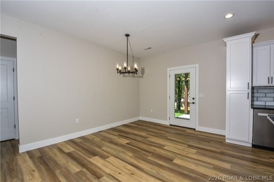 BRAND NEW HOME in the HEART of Osage Beach!! This striking home - photo 22