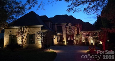 Located in the exclusive gated community of Chatelaine, this - photo 2