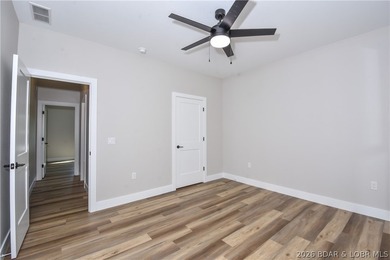 BRAND NEW HOME in the HEART of Osage Beach!! This striking home - photo 23