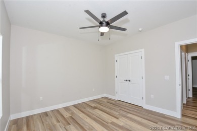 BRAND NEW HOME in the HEART of Osage Beach!! This striking home - photo 24