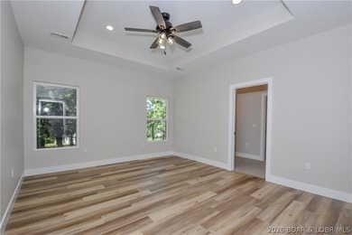 BRAND NEW HOME in the HEART of Osage Beach!! This striking home - photo 25