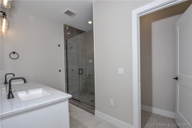 BRAND NEW HOME in the HEART of Osage Beach!! This striking home - photo 27