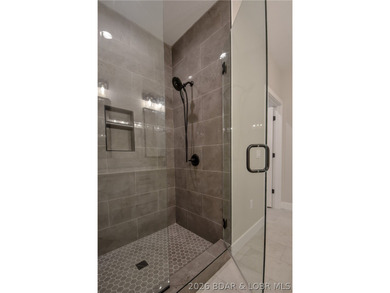 BRAND NEW HOME in the HEART of Osage Beach!! This striking home - photo 30