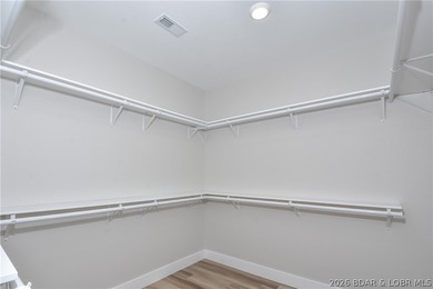 BRAND NEW HOME in the HEART of Osage Beach!! This striking home - photo 32