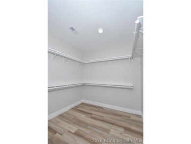 BRAND NEW HOME in the HEART of Osage Beach!! This striking home - photo 33