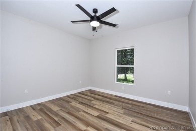 BRAND NEW HOME in the HEART of Osage Beach!! This striking home - photo 35