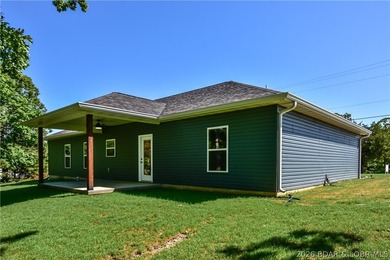BRAND NEW HOME in the HEART of Osage Beach!! This striking home - photo 39