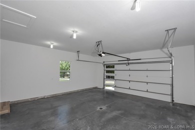BRAND NEW HOME in the HEART of Osage Beach!! This striking home - photo 40