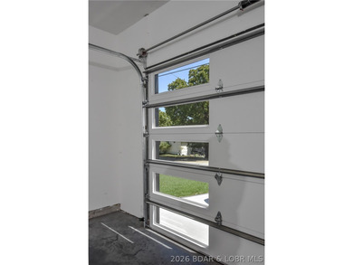 BRAND NEW HOME in the HEART of Osage Beach!! This striking home - photo 41