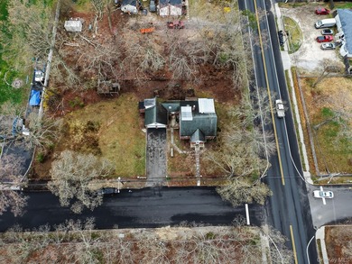 This spacious corner property nestled on a estimated half-acre - photo 11